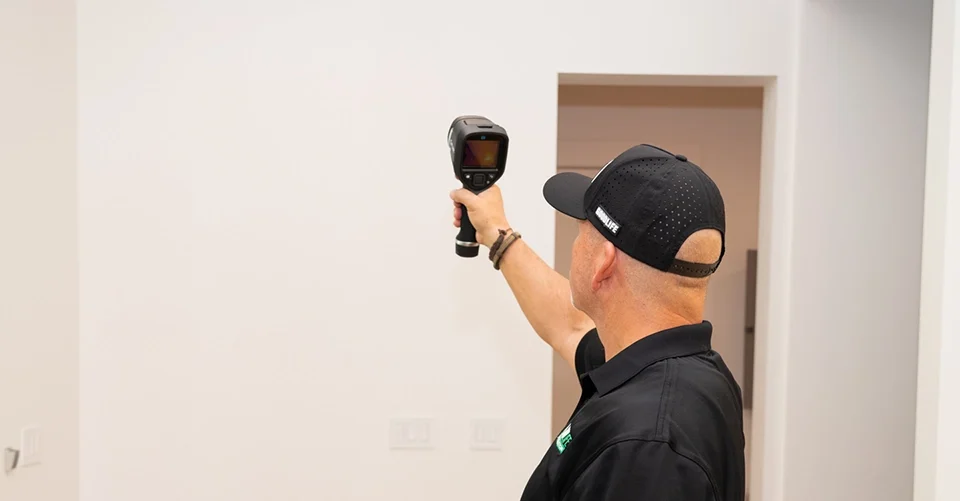 Inspector performing Title 24 energy efficiency inspection in Sacramento at a residential home, illustrating benefits like energy savings, compliance, and increased property value.