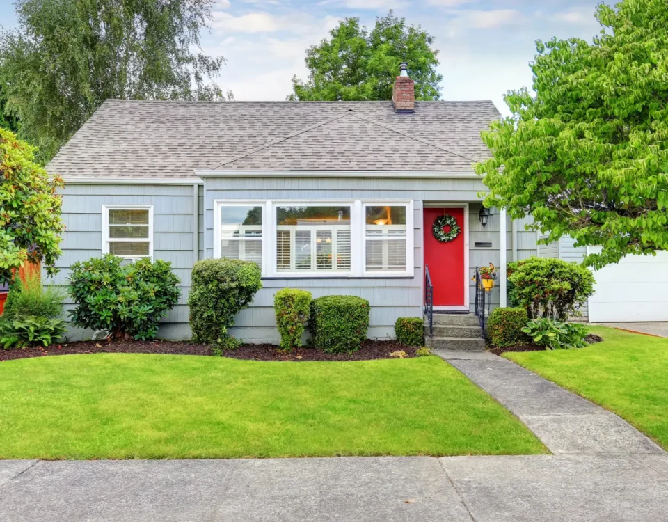 Older house exterior with mature trees, representing old house pros and cons