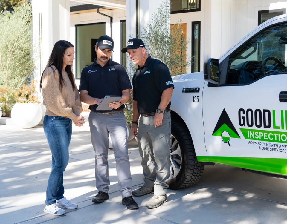 Good Life Inspections inspectors reviewing a home inspection report with a buyer